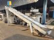 Inclined conveyor belt with talisca