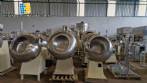 Set of ten stainless steel coating pans with capacities between 150 liters and 350 liters