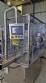 Complete filling line with Tecman Nelpas Tecnoenvase Tudela bottle filling, labeling, capping, and positioning machines for cosmetic liquids.