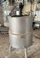 Jacketed mixing tank with heating element, made of stainless steel.