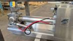 Unifiller stainless steel dosing pump with homogenizing mixer for bakery foods.
