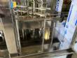Gravimetric rotary filling machine in stainless steel with cabin