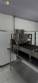 Automatic stainless steel deep fryer for donuts and cream puffs.