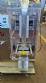 Dosing and packaging machine for granular and powdered products