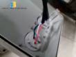 Automatic labeler for flat bottles