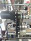 Vertical wrapping machine for triangular format