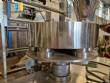 Vertical wrapping machine for triangular format