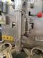 Vertical wrapping machine for triangular format