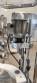 Bottle and jar screwing machine with automatic cap feeding system