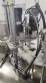 Rotary filling line for dropper bottles with Certo cylindrical self-adhesive labels