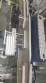 Rotary filling line for dropper bottles with Certo cylindrical self-adhesive labels