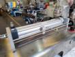 Countertop stainless steel filling machine for liquids and viscous liquids