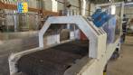Labeling machine with steam sleeve tunnel and bottle baler