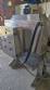 Labeling machine with steam sleeve tunnel and bottle baler