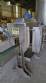 Labeling machine with steam sleeve tunnel and bottle baler
