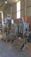 Labeling machine with steam sleeve tunnel and bottle baler