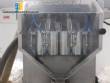 Filling line with capsule counter and screw machine