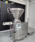 Handtmann vacuum stuffer with twister and tilting elevator, up to 6,000 kg per hour.