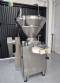 Handtmann vacuum stuffer with twister and tilting elevator, up to 6,000 kg per hour.