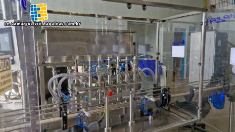 Complete filling line with Tecman Nelpas Tecnoenvase Tudela bottle filling, labeling, capping, and positioning machines for cosmetic liquids. Complete filling line with Tecman Nelpas Tecnoenvase Tudela bottle filling, labeling, capping, and positioning machines for cosmetic liquids.